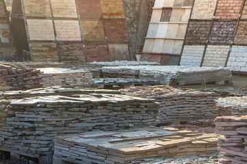 Pallets with natural facing stone and cobblestones