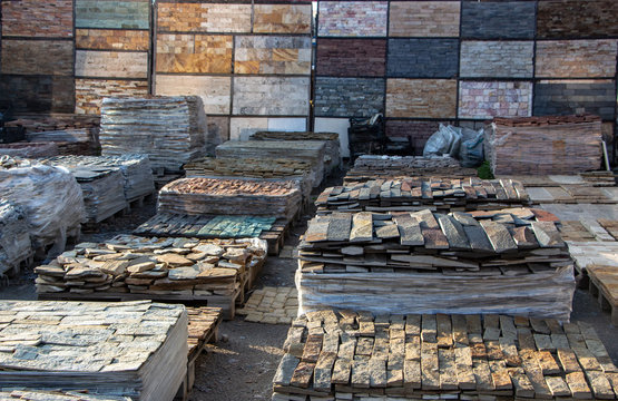 Pallets with natural facing stone and cobblestones