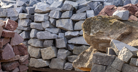 Pallets with natural facing stone and cobblestones