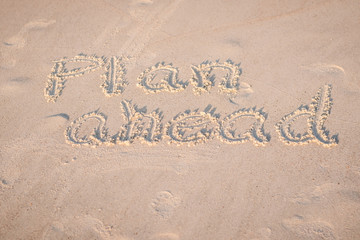 The Words "Plan Ahead" Written in the Sand