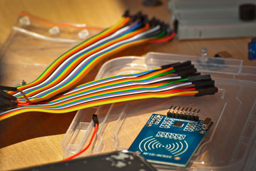 Electronics and robotics of handmade. Microcircuits and colored wires close up. Electronic devices and mechanisms are presented at the scientific exhibition.