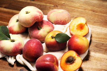 Fototapeta na wymiar A group of ripe peaches on table