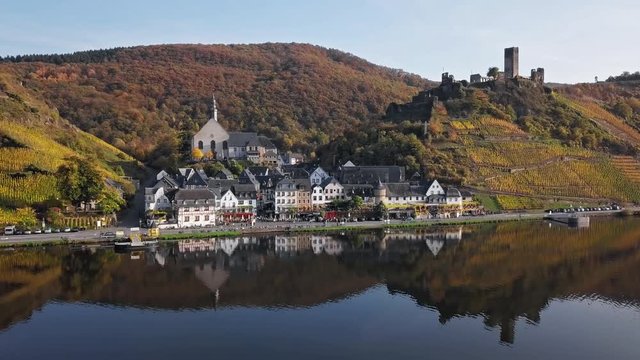 Flight over Beilstein town and autumn vineyards, Mosel valley, Germany.