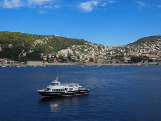 Fototapeta na wymiar Beautiful boat sailing in the Mediterranean. The coastal city of Nice.