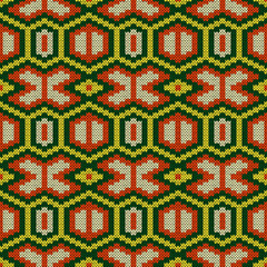 Knitting ornate seamless pattern in green, yellow and orange colors