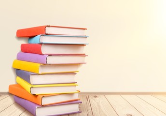 Stack books on wooden desk table