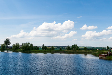 Fototapeta premium summer time. landscape. sky and small lake.