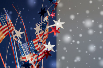 Festive Fourth of July background abstract concept with bokeh, stars, and USA flags, useful for patrotic USA themed backgrounds