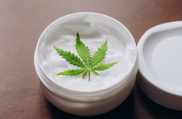 Cosmetic cream made of natural cannabis, hemp, moisturizing lotion with CBD content. Copy space for your design use,text