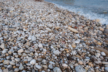 Beautiful and colourful sea pebbles on the beach.
