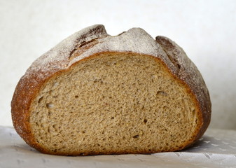 freshly baked bread on a white tablecloth, side view