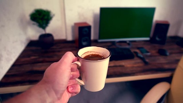 Businessman carrying a cup of espresso coffee