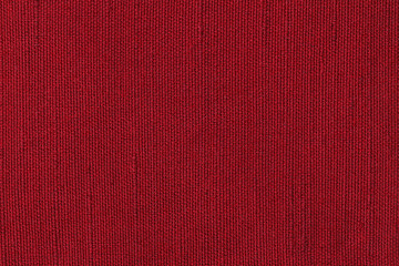 Red fabric background texture. Detail of textile material close-up
