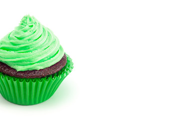 A Single Green Iced Chocolate Cupcake Isolated on a White Background
