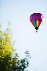 Purple Rainbow Hot Air Balloon Flying in Air 