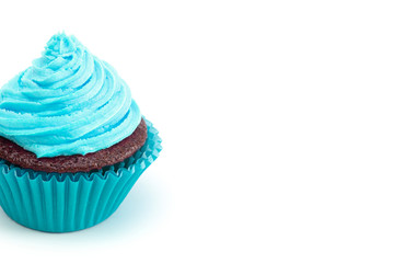A Single Turquoise Iced Chocolate Cupcake Isolated on a White Background