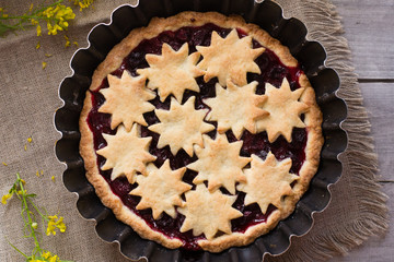 Cherry tart on wooden table