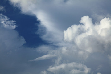 Fototapeta na wymiar A huge cumulus and cumulonimbus clouds on the blue sky background