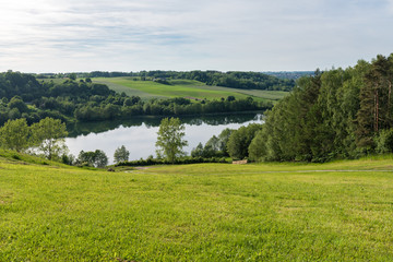 Fototapeta na wymiar Stunning panorama of the Brodno Male lake and neighbouring hills during spring. Kashubia, Poland