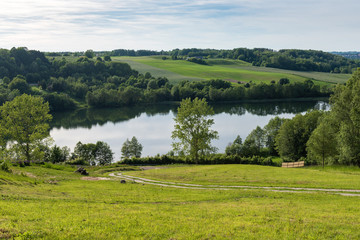 Stunning panorama of the Brodno Male lake and neighbouring hills during spring. Kashubia, Poland