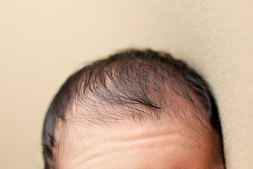 Newborn Baby Boy Head with Hair Wisps