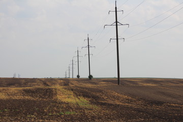 Obraz premium electricity pylons at sunset