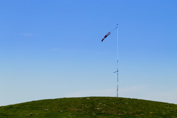 Fototapeta na wymiar Isolated windsock on blue sky, sport background
