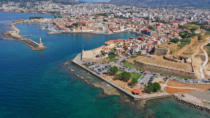 Naklejka na ściany i meble Aerial drone panoramic view of iconic and picturesque Venetian old port of Chania with famous landmark lighthouse and traditional character, Crete island, Greece