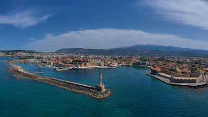 Naklejka na ściany i meble Aerial drone panoramic view of iconic and picturesque Venetian old port of Chania with famous landmark lighthouse and traditional character, Crete island, Greece