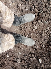 Old black dirty shoes. Leather military shoes. Military shoes soldier.