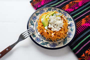 Mexican fideos dry soup with avocado and cheese