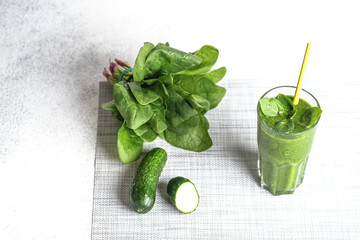 Organic berry and vegetable smoothie with oatmeal on a light background copy space. Healthy food. Lactose free diet.