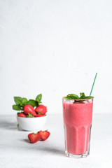 Organic berry and vegetable smoothie with oatmeal on a light background copy space. Healthy food. Lactose free diet.