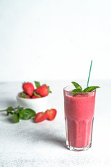 Organic berry and vegetable smoothie with oatmeal on a light background copy space. Healthy food. Lactose free diet.