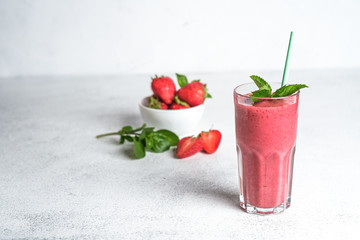 Organic berry and vegetable smoothie with oatmeal on a light background copy space. Healthy food. Lactose free diet.
