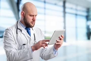 Close-up Doctor at hospital working with tablet pc