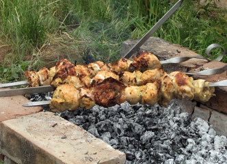  chicken meat is cooked on charcoal         