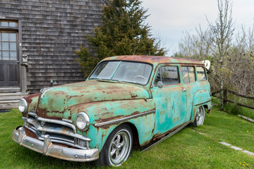 green old classic car rusting away