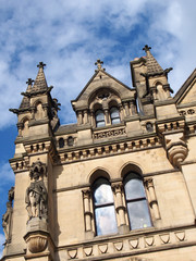 Fototapeta na wymiar close up detail view of bradford city hall in west yorkshire a victorian gothic revival sandstone building with statues and clock tower