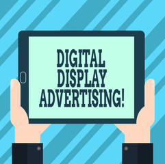 Text sign showing Digital Display Advertising. Conceptual photo conveys a commercial message using graphics Hu analysis Hand Holding Blank Screen Tablet Smartphone Display Unit photo
