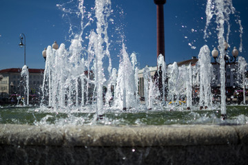 fountain water on blue sky background