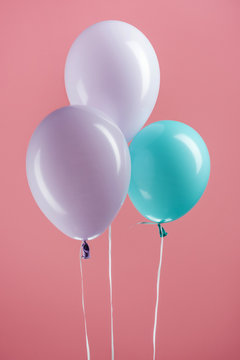 Blue And Purple Colorful Decorative Balloons On Pink Background