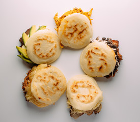 Group of arepas stuffed with various ingredients, Latin American food