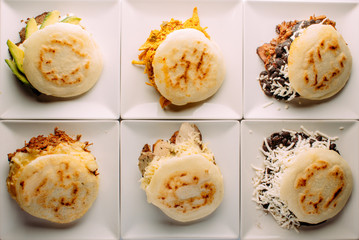 Group of arepas stuffed with various ingredients, Latin American food