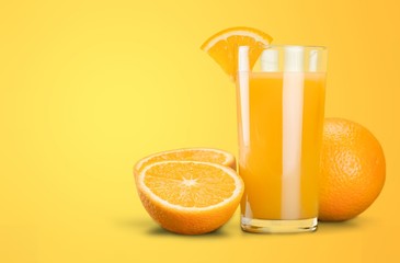 Orange juice and slices of orange on background
