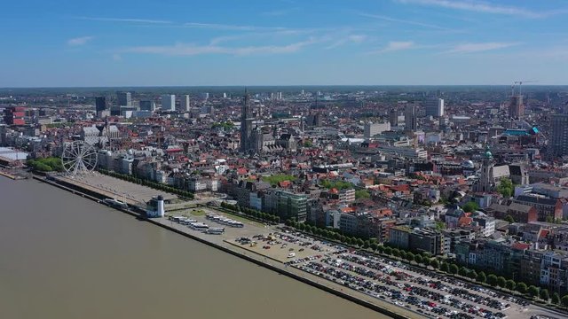 Aerial view of cityscape of Antwerp, gothic style landmark Cathedral of Our Lady Antwerp and river Scheldt in historic center of city, blue sky - landscape panorama of Belgium from above, Europe