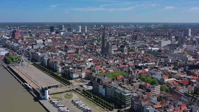 Aerial view of cityscape of Antwerp, gothic style landmark Cathedral of Our Lady Antwerp and river Scheldt in historic center of city, blue sky - landscape panorama of Belgium from above, Europe