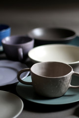 Obraz na płótnie Canvas Collection of pottery and kitchenware in muted pastel colors. Selective focus.