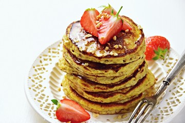 Paleo hazelnut pancakes with honey and strawberry. Gluten and sugar free pancakes