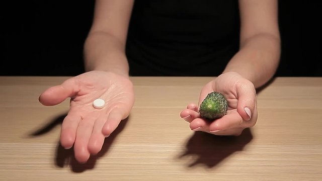 woman hand cucumber pill table hd footage 